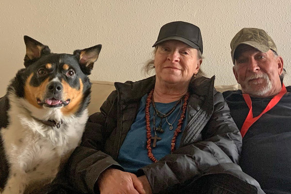 Debby and Kris, two Mosaic patients, and their dog