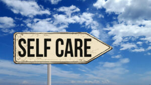 Road sign that says "self care"